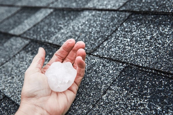 hail hand on rooftop after 600nw 720101785